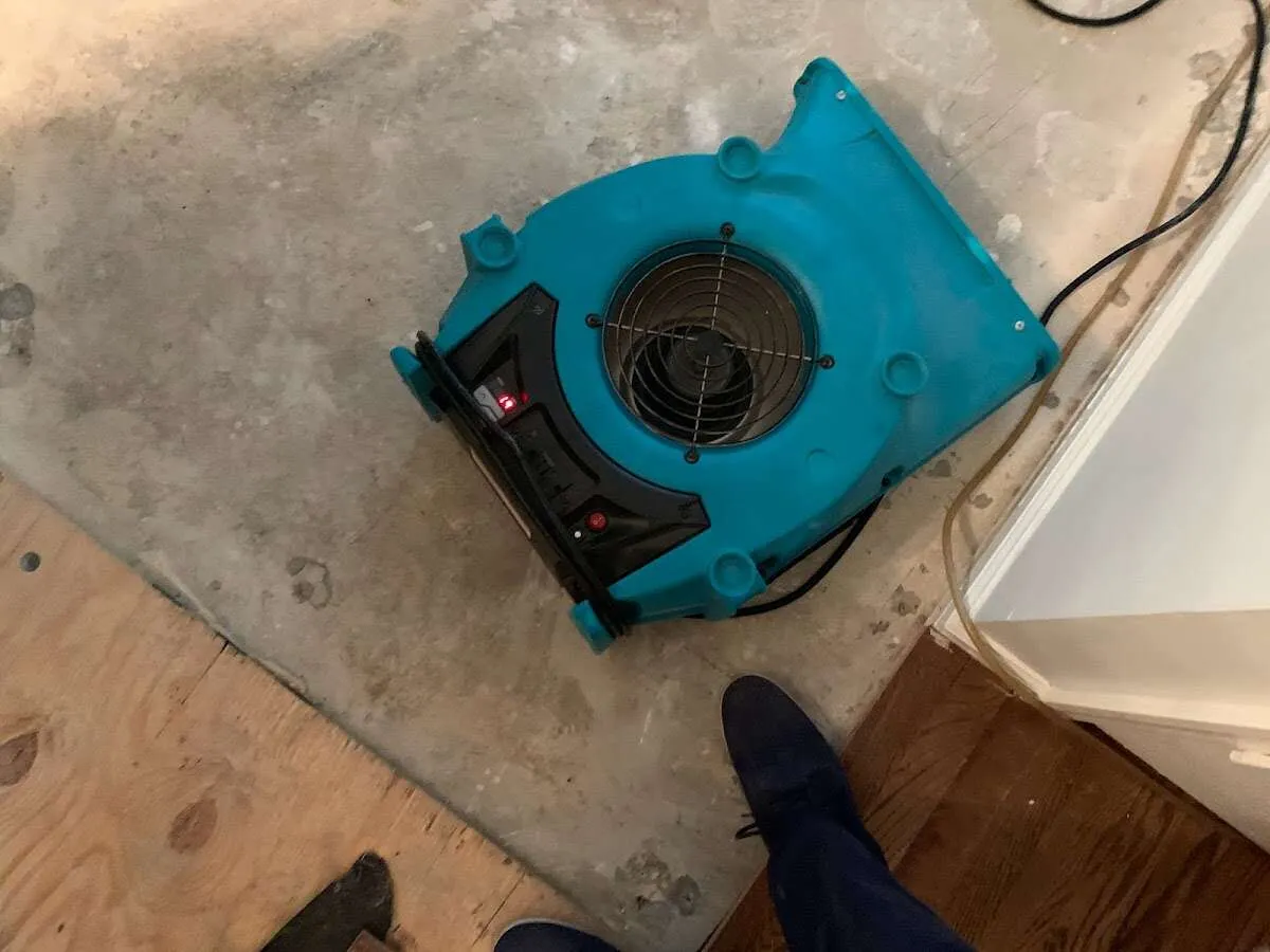 Air mover drying subfloor during Leak Detection & Repair in Richmond Heights